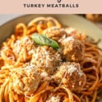 Close-up of spaghetti topped with golden-brown turkey meatballs, grated cheese, and a fresh basil leaf, with the text 'Air Fryer Turkey Meatballs' above and the website URL marialuceydietitian.com below on a peach background.