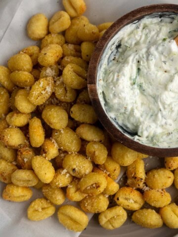 Crispy air fryer gnocchi served with a creamy Greek yogurt tzatziki dip. A quick, high-protein snack or appetizer that’s golden on the outside and fluffy inside.