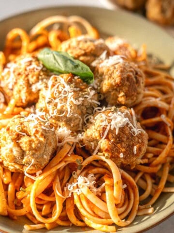 air fryer turkey meatballs in a bowl with pasta and a tomato sauce