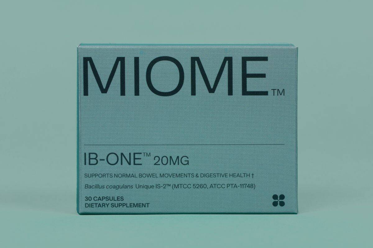 Box of MIOME IB-ONE probiotic supplement containing Bacillus coagulans Unique IS-2 placed on a teal background.