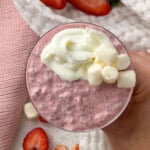 Close-up of pink strawberry chia seed pudding with creamy yogurt topping and marshmallows