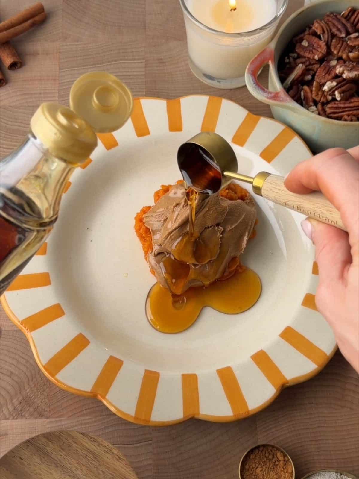 Pumpkin purée, almond butter and maple syrup in a mixing bowl for pumpkin protein balls.